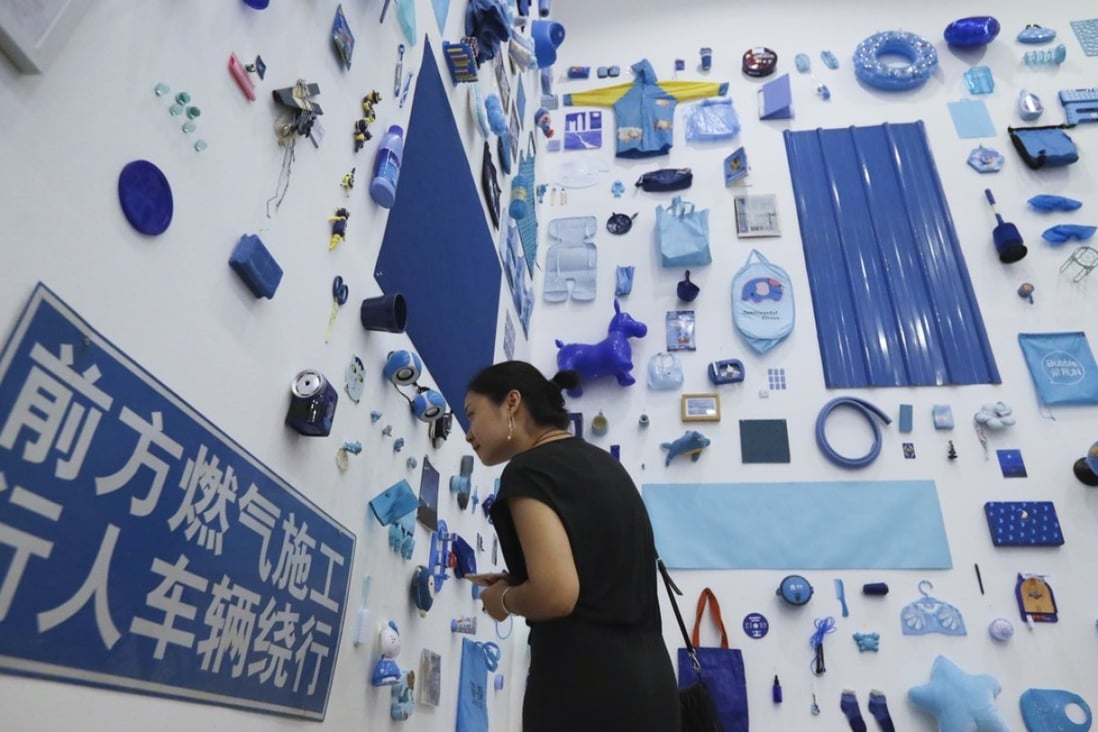 Our Red Pocket for Your Favourite Blue exhibition at OCT Art & Design Gallery in Shenzhen by Polit-Sheer-Form Office encourages visitors to swap so-called lucky money for a donated blue item. Photo: sNora Tam