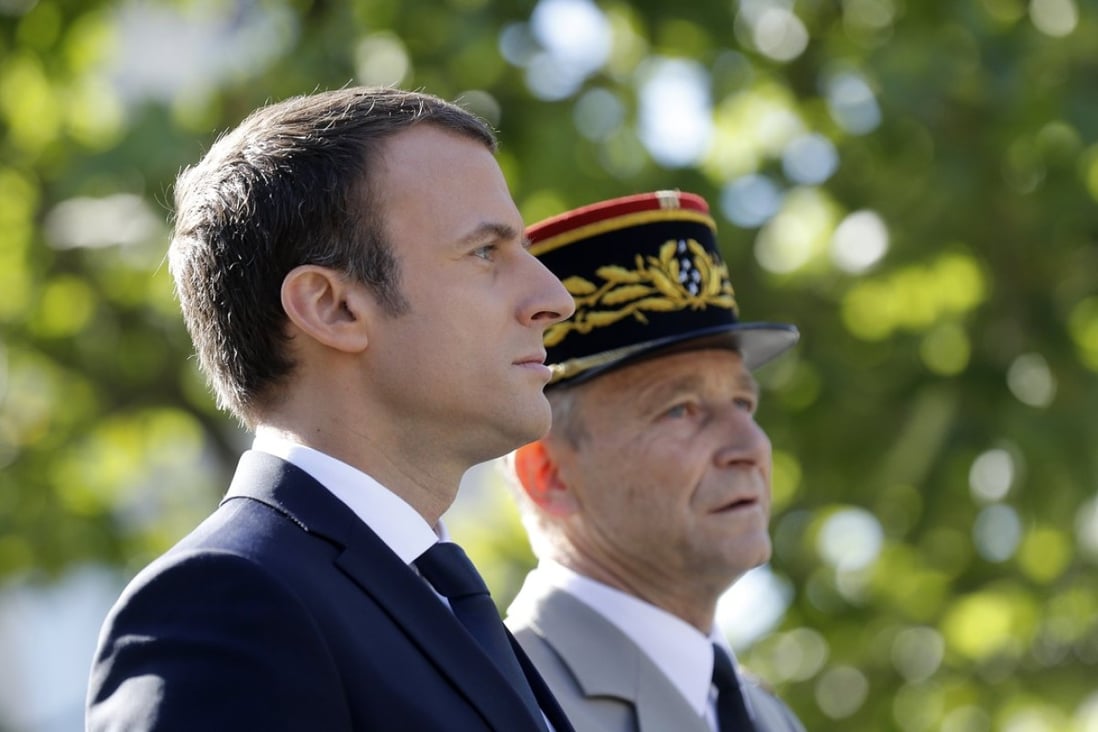 French President Emmanuel Macron (left) and his former Chief of the Defence Staff, French Army General Pierre de Villiers at the annual Bastille Day military parade on the Champs Elysees avenue in Paris on July 14. Photo: EPA