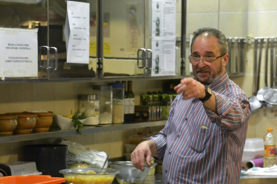 Gorka Arcelus prepares tortilla at Amaikak-Bat in San Sebastian, Spain. The previous evening the amateur chef, 63, had cooked for 70 fellow club members. Photo: Chris Dwyer
