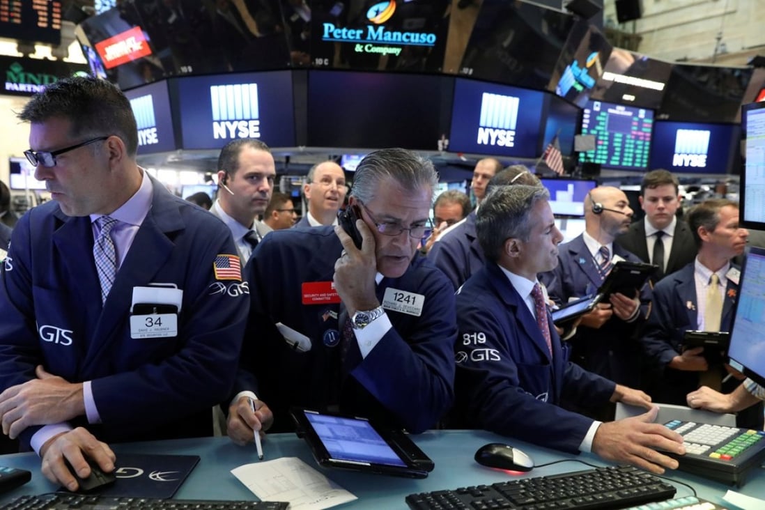 Traders in the New York Stock Exchange on July 19. Correlated world markets means there may be no place to hide. Photo: Reuters