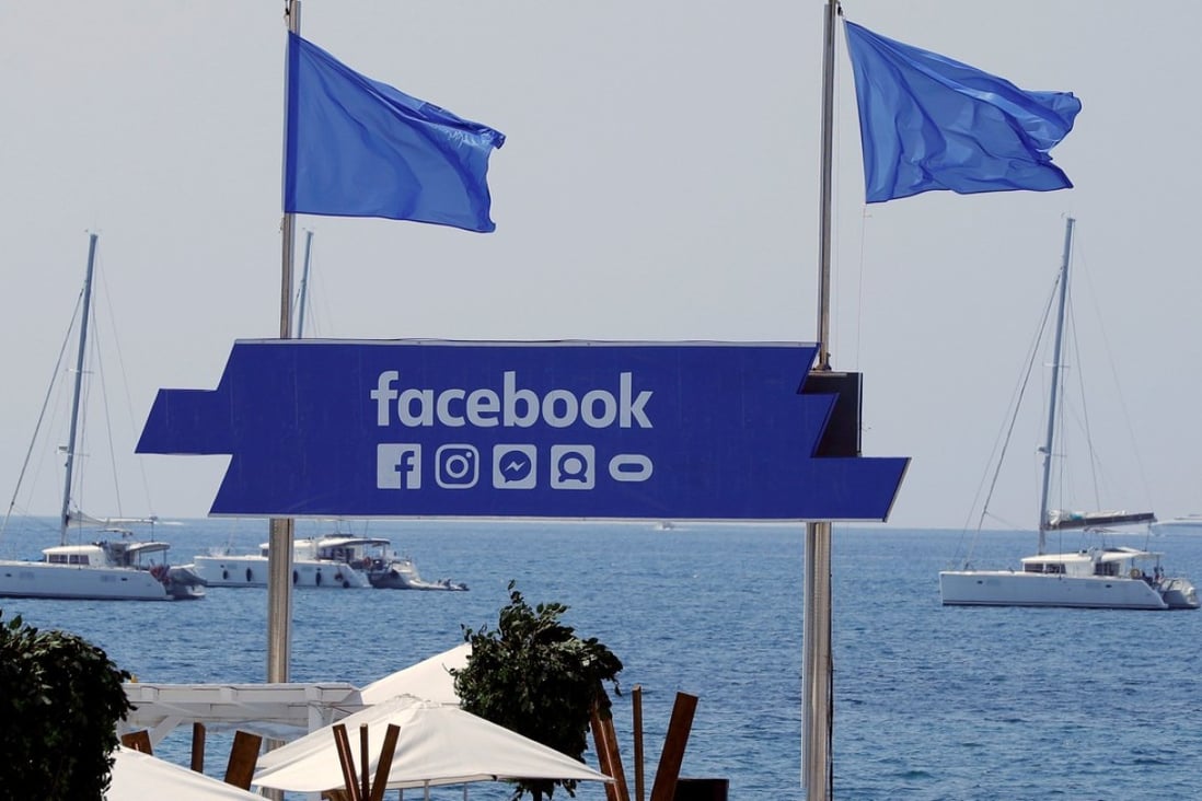 The logo of the social network giant Facebook is seen on a beach in Cannes, France. The EU is increasing pressure on Facebook and other tech firms such as Google regarding their user terms. Photo: Reuters