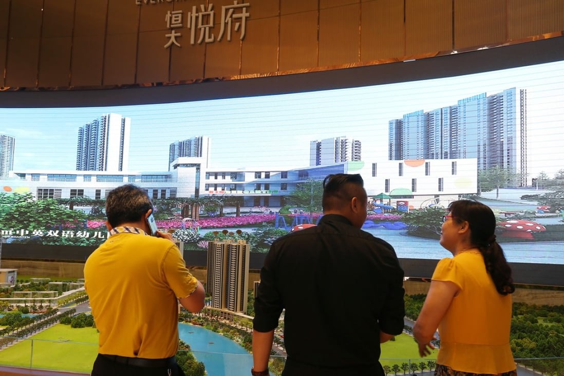 Propsective buyers checking out a scale model of the Evergrande Mansion development at the Nanhai Gaoxin district in Foshan city in Guangdong province. Photo: SCMP/Xiaomei Chen