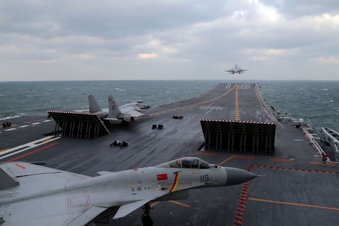 Chinese J-15 fighter jets are launched from the deck of the Liaoning aircraft carrier during earlier military drills in the Yellow Sea on December 23. Photo: AFP