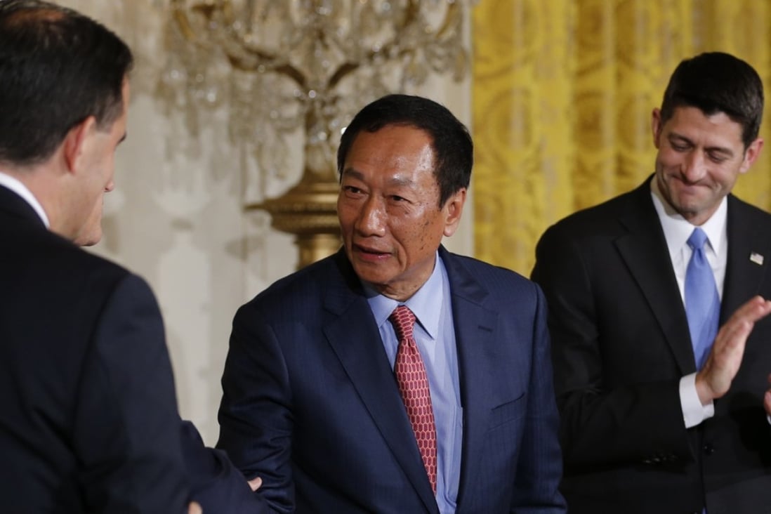 Foxconn Chairman Terry Gou (C) greets Wisconsin Governor Scott Walker (L) as House Speaker Paul Ryan applauds during a White House event where the Taiwanese electronics manufacturer Foxconn announced plans to build a US$10 billion dollar LCD display panel screen plant in Wisconsin. Photo: Reuters
