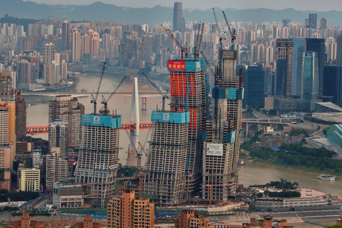 China’s property bubble is one of the “grey rhinos” stalking the economy, a senior Chinese economist has warned. Photo: Reuters