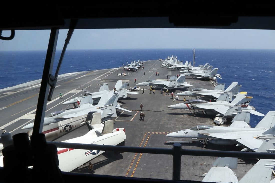 Fighter jets on board the US Navy aircraft carrier USS Carl Vinson are prepared for patrols off the disputed South China Sea in this March file photo. Photo: Associated Press