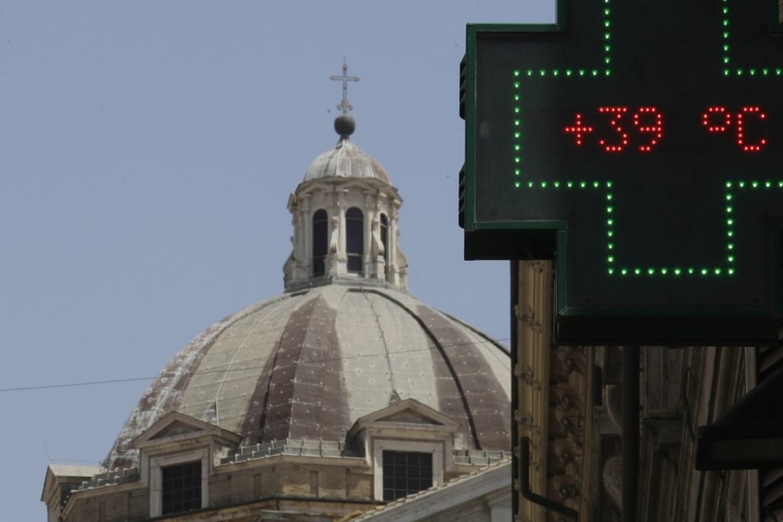 A thermometer displays 39 degrees Celsius (103 Fahrenheit) outside a chemist's shop in Rome. Scientists are warning that weather-related deaths could spike by the end of the century due to climate change. Photo: AP