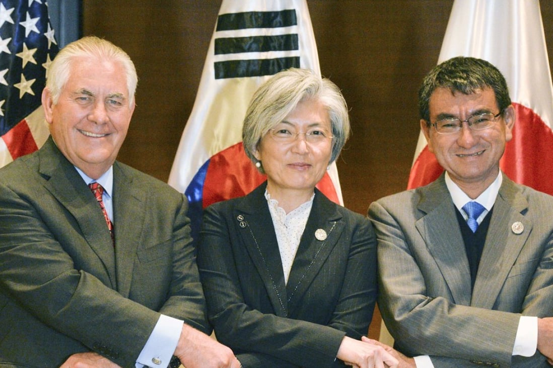 US Secretary of State Rex Tillerson, South Korean Foreign Minister Kang Kyung-wha and Japanese Foreign Minister Taro Kono shake hands in Manila before their trilateral talks. The ministers agreed to ramp up international pressure on North Korea. Photo: Kyodo