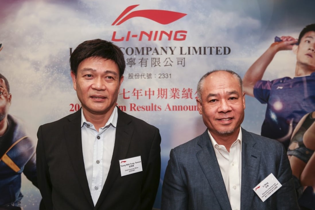 Chief financial officer, Terence Tsang Wah-fung (left) and executive chairman and interim chief executive officer Li Ning (right) reveal its interim results in Hong Kong on Friday. Photo: Xiaomei Chen
