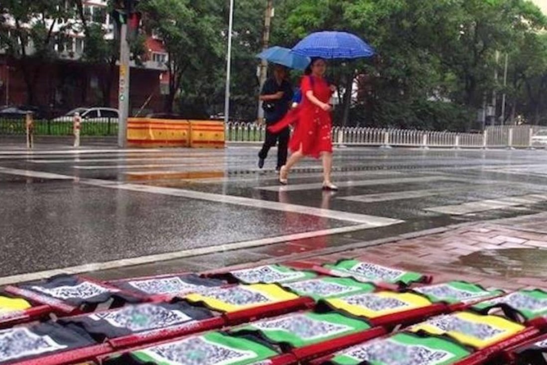 The folding stools for rent in rainy Beijing. Photo: Handout