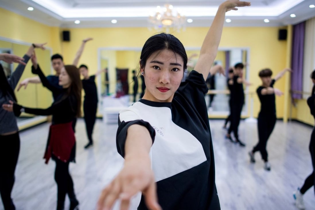 Zhang Yuying (centre) attending a dance class at the Yiwu Industrial & Commercial College in Yiwu, in Zhejiang Province. Hordes of Chinese millennials are speaking directly to the country's 700 million smartphone users, streaming their lives to lucrative effect, fronting brands and launching businesses. They are known locally as "wanghong". Photo: AFP