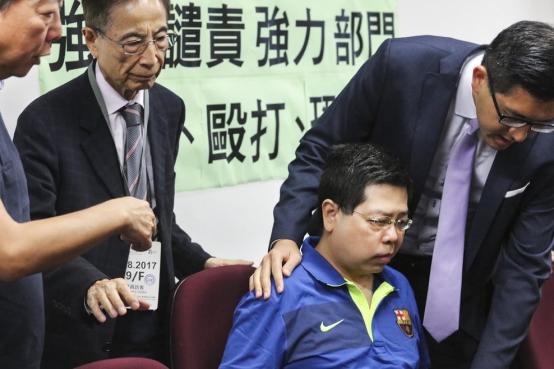 Howard Lam Tsz-kin (seated) with pan-democrats at his press conference last Friday. Photo: Felix Wong