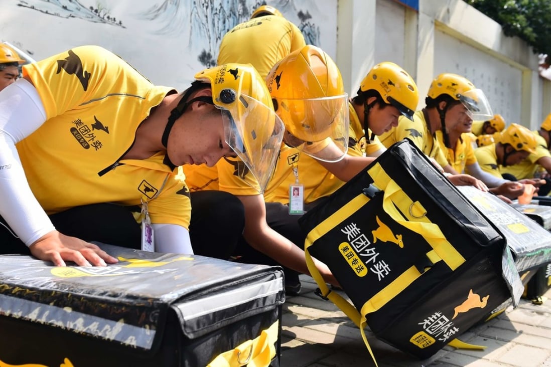 Couriers package food for delivery in Jinan, Shandong Province. Delivery companies have become the strongest demand driver for prime warehouse space in China. Photo: Xinhua