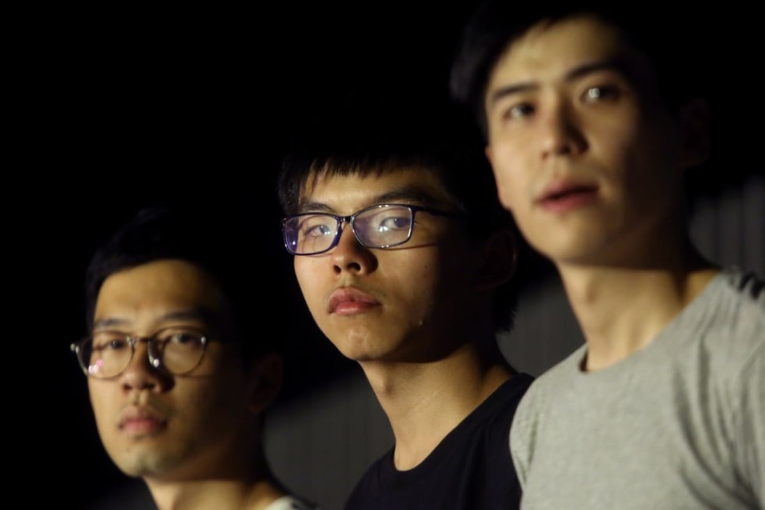 (From left) Nathan Law Kwun-chung, Joshua Wong Chi-fung and Lester Shum attend a protest in support of 13 protesters who were jailed on Tuesday. Photo: Sam Tsang