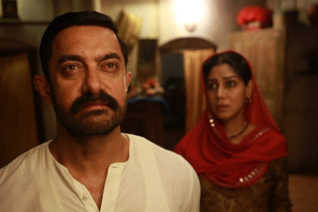 Aamir Khan (left) and Sakshi Tanwar play husband and wife in Dangal (category IIA, Hindi), directed by Nitesh Tiwari and also starring Fatima Sana Shaikh.