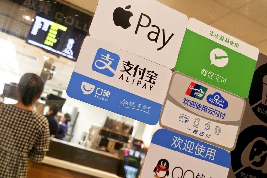 A signboard of payments through Apple Pay, Alipay of Alibaba Group, WeChat Payment and QQ Payment of Tencent, and China UnionPay is pictured at a store in Guangzhou. Photo: SCMP Handout