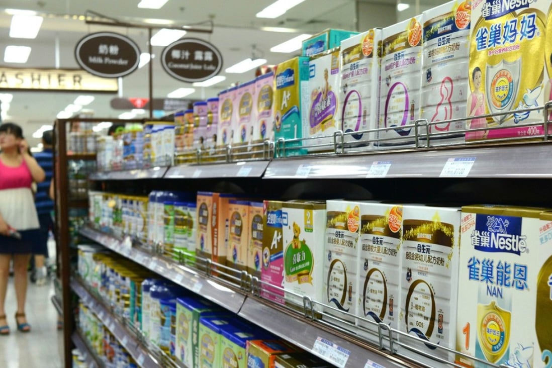 Shelves of milk powder at a supermarket in Beijing in July 2013, amid an investigation into alleged price-fixing by foreign firms in the infant formula sector. Photo: AFP