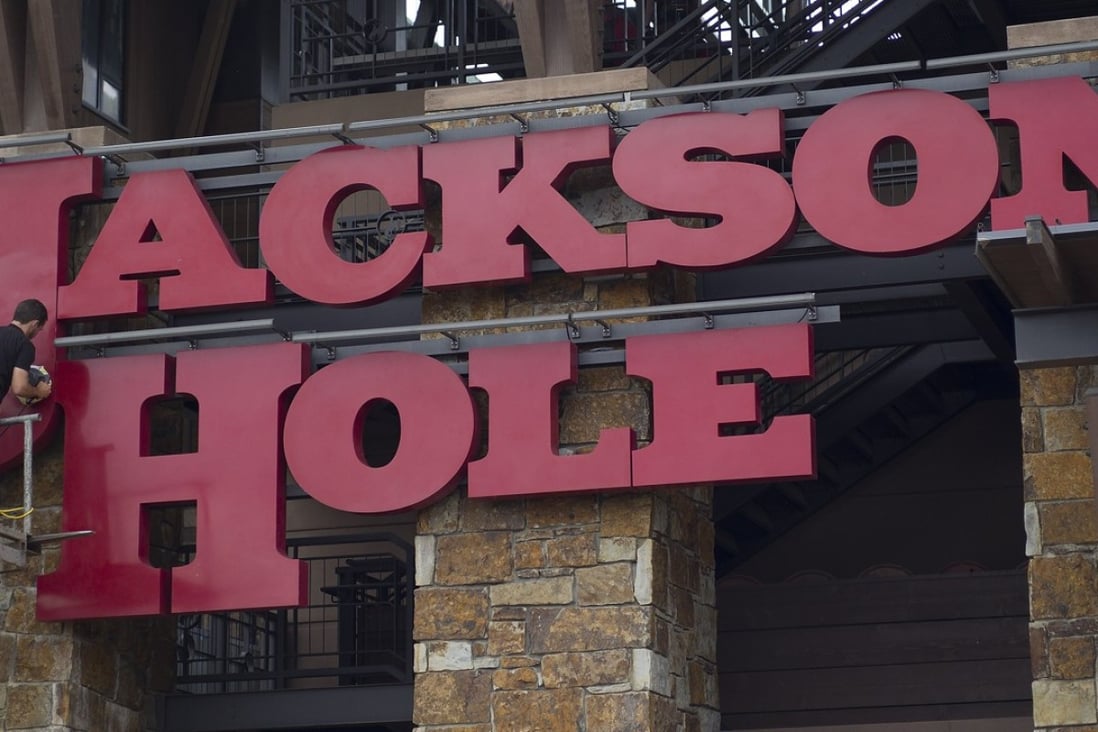 Employees put the finishing touches on exterior signage at the Jackson Hole Mountain Resort in Jackson, Wyoming, ahead of the central bankers’ meeting which gets underway Thursday. Photo: EPA