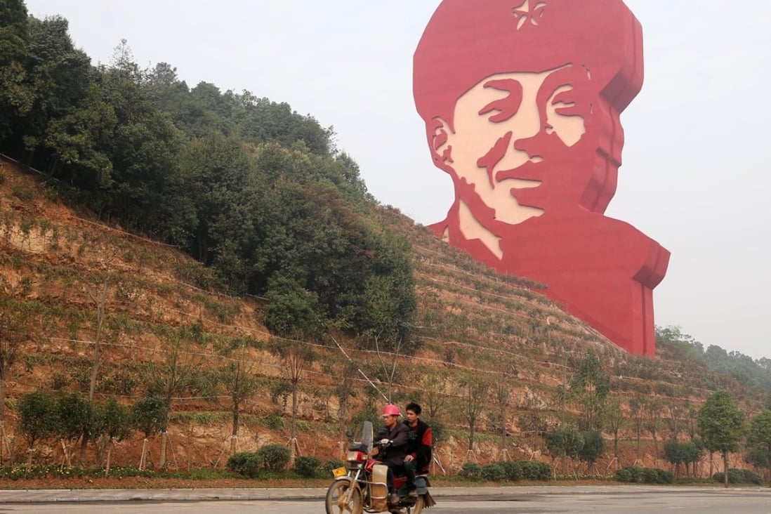 A 30-metre statue of Lei Feng dominates the horizon in Changsha, the hometown in Hunan province of the Cultural Revolution hero whose story has been used to instil the love of country in generations of Chinese students. Photo: Xinhua