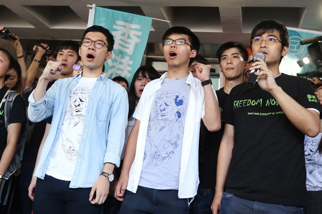 Nathan Law, Joshua Wong and Alex Chow outside the High Court in Hong Kong. Photo: Edward Wong