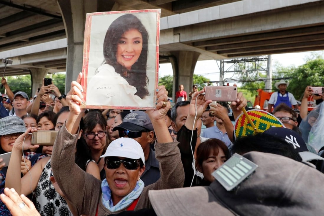 Supporters of ousted former Thai prime minister Yingluck Shinawatra outside the Supreme Court in Bangkok. Photo: Reuters