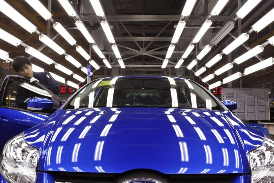 An employee at a Ford assembly line in Chongqing. Photo: Reuters