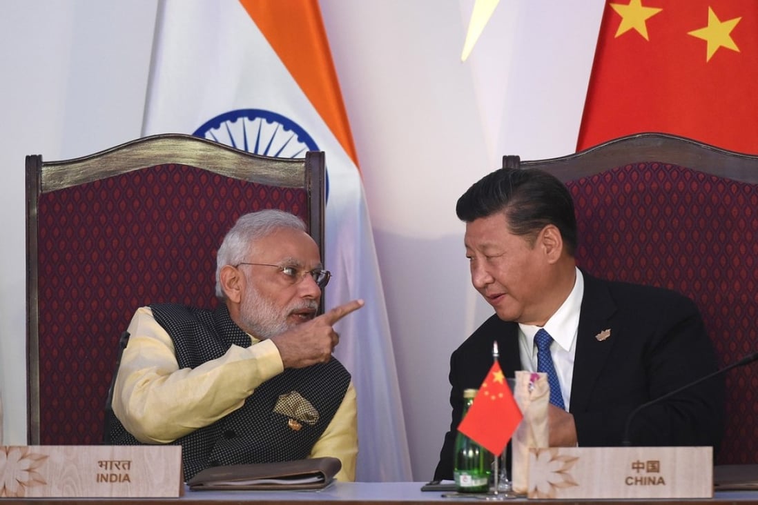 India Prime Minister Narendra Modi (left) talks to President Xi Jinping during a BRICs leaders' meeting in the Indian state of Goa in 2016. Photo: AFP