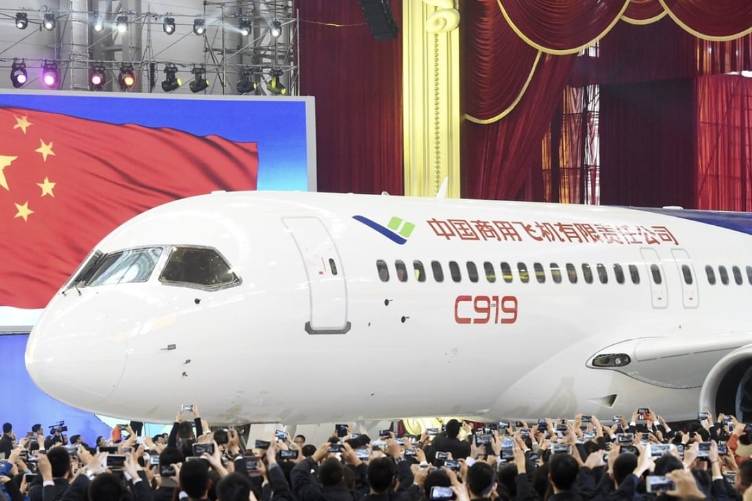 The first C919 passenger jet made by Comac is rolled out during a news conference at the company's factory in Shanghai, in November 2015. Photo: Reuters