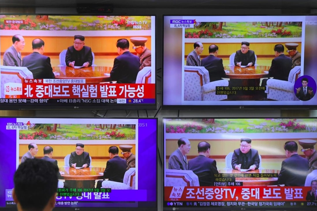 A South Korean official at the Korea Meteorological Administration watches television news channels showing North Korean leader Kim Jong-un on Sunday. The tremor from Pyongyang’s sixth nuclear test was five to six times more powerful than that of the fifth test, the agency said. Photo: AFP