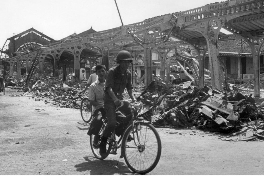 A South Vietnamese soldier rides his bike near the destroyed market of Kien Hoa, in February 1968, after a North Vietnamese attack as part of the Vietcong Tet offensive during the Vietnam war. Photo: AFP