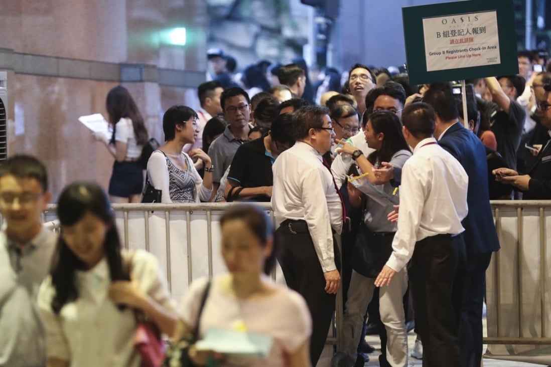 Hundreds of prospective buyers queued up in Tsim Sha Tsui for 130 flats at Oasis Kai Tak. Photo: Edward Wong