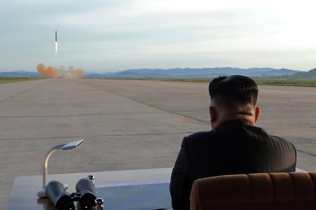 An undated photo released on 16 September 2017 by the North Korean Central News Agency (KCNA), the state news agency of North Korea, is described as showing the country's leader Kim Jong Un (R), supreme commander of the Korean People's Army, guiding a launching of the medium-to-long range strategic ballistic rocket Hwasong-12 at an unspecified location (issued 16 September 2017). EPA-EFE/KCNA