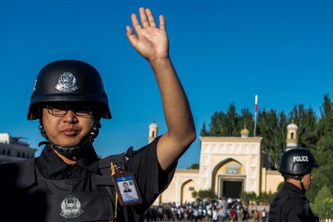 Police on patrol near a mosque in Kashgar in China’s restive Xinjiang province. The nation’s security chief hopes the use of technology will help predict where terror attacks may take place. Photo: AFP