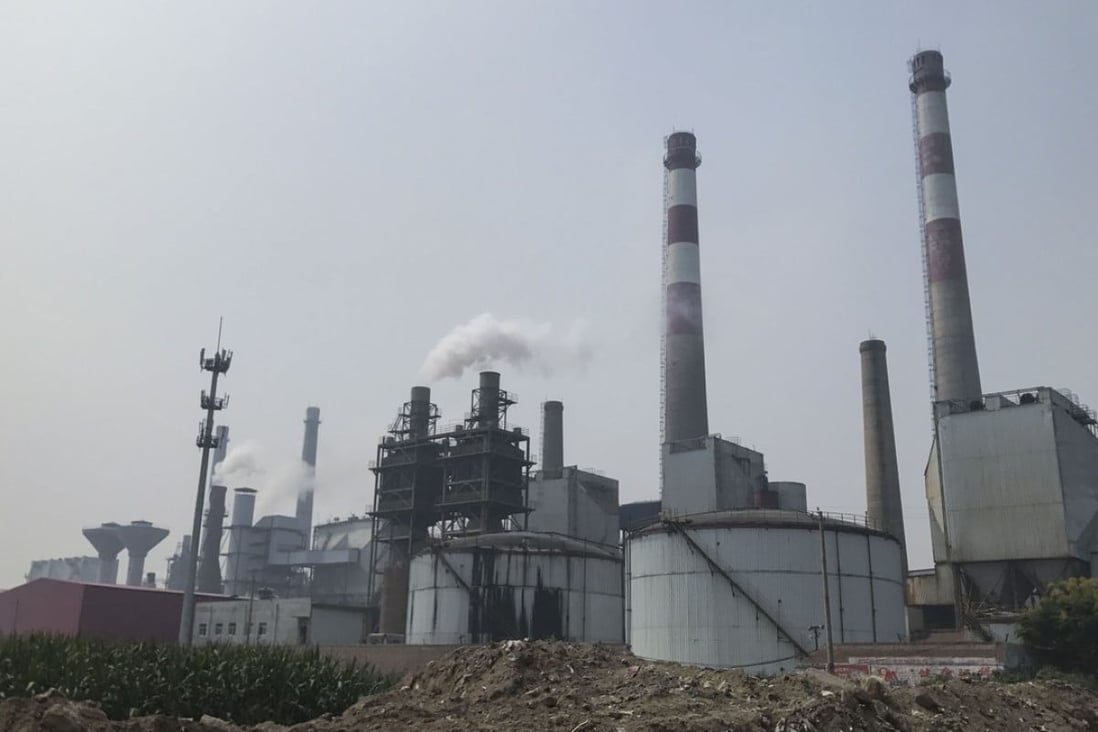 Chimneys at a glass factory in Shahe, Hebei, emit plumes of sour-smelling steam on September 12. Photo: Viola Zhou
