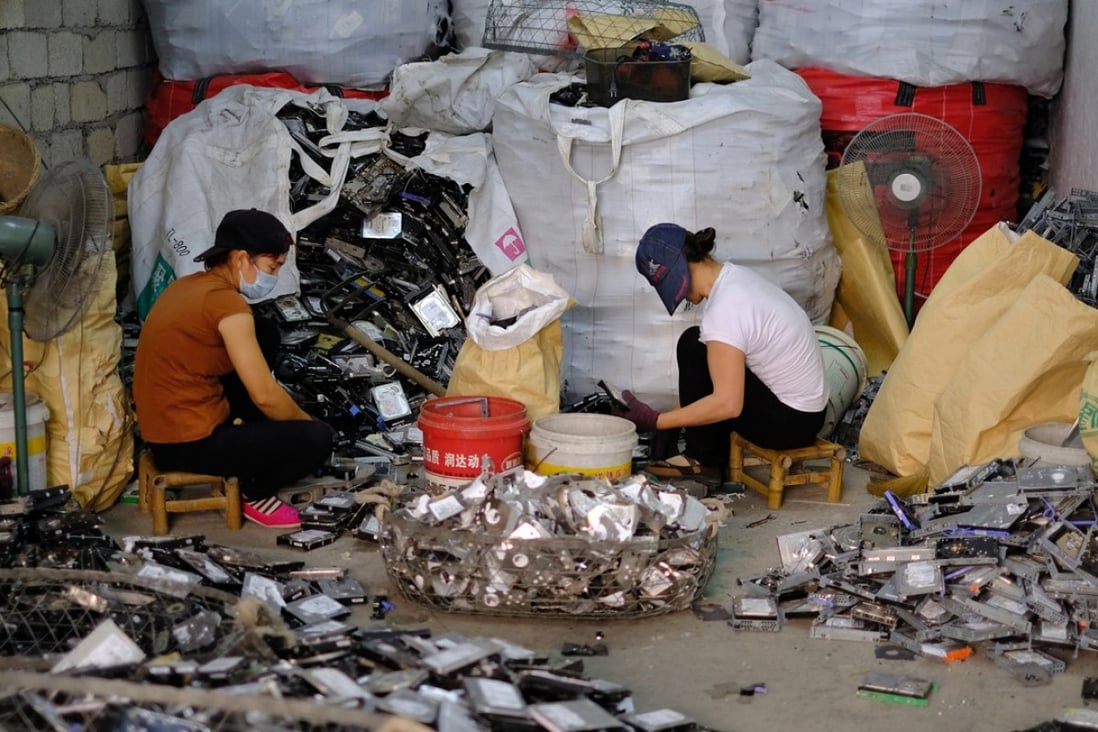 Workers dismantle discarded electronic components at the Guiyu Recycling Economy Industrial Park in Shantou, Guangdong, this month. Photo: Lea Li