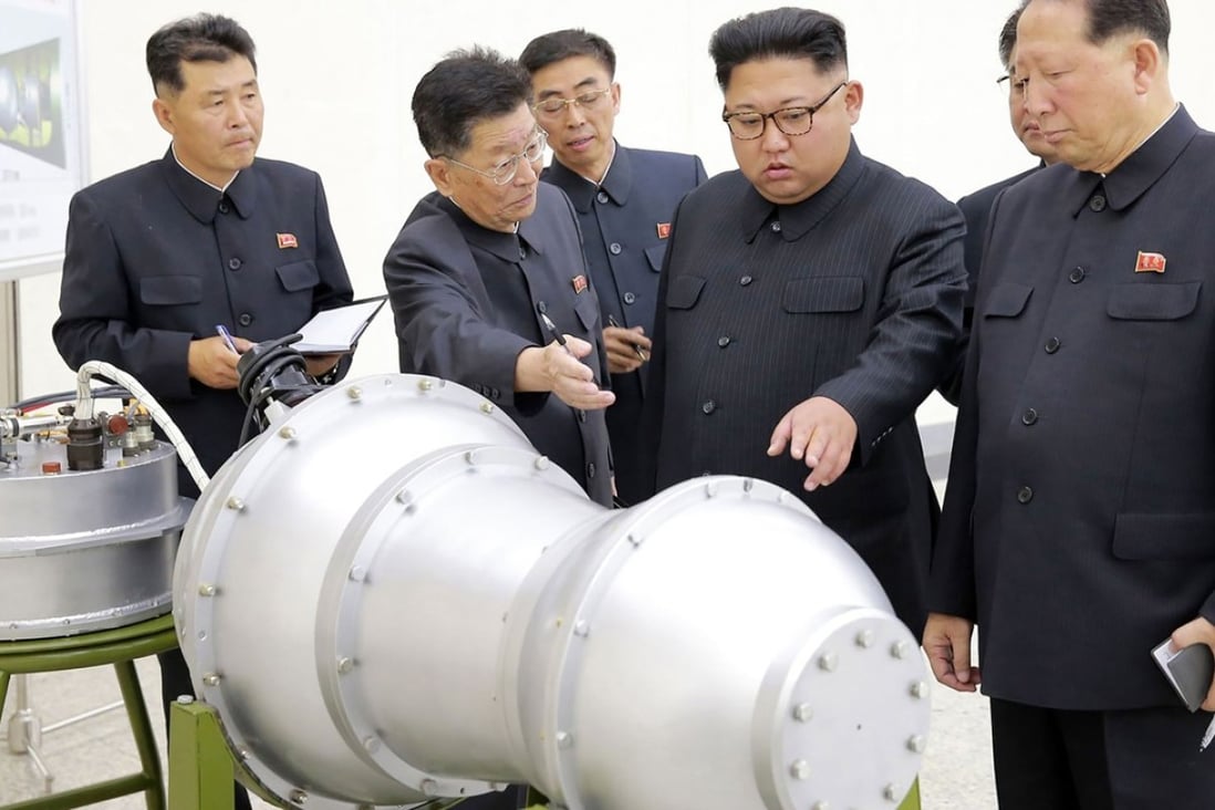 North Korean leader Kim Jong-un inspects what is said to be a miniaturised hydrogen bomb. Photo: AFP