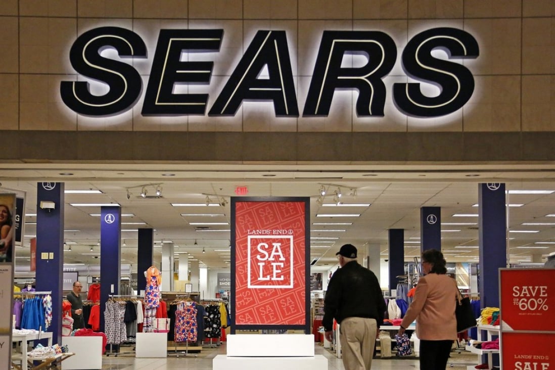 Shoppers walk into a Sears store in Pittsburgh. Department stores may be struggling to draw customers, but they have not relinquished their hold on America’s malls. Photo: AP