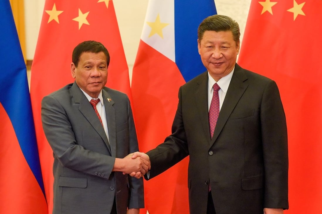 Chinese President Xi Jinping (right) shakes hands with Philippines President Rodrigo Duterte prior to their meeting in Beijing in May. Ties between the two countries have improved since Beijing became involved in Manila’s war on drugs. Photo: Reuters