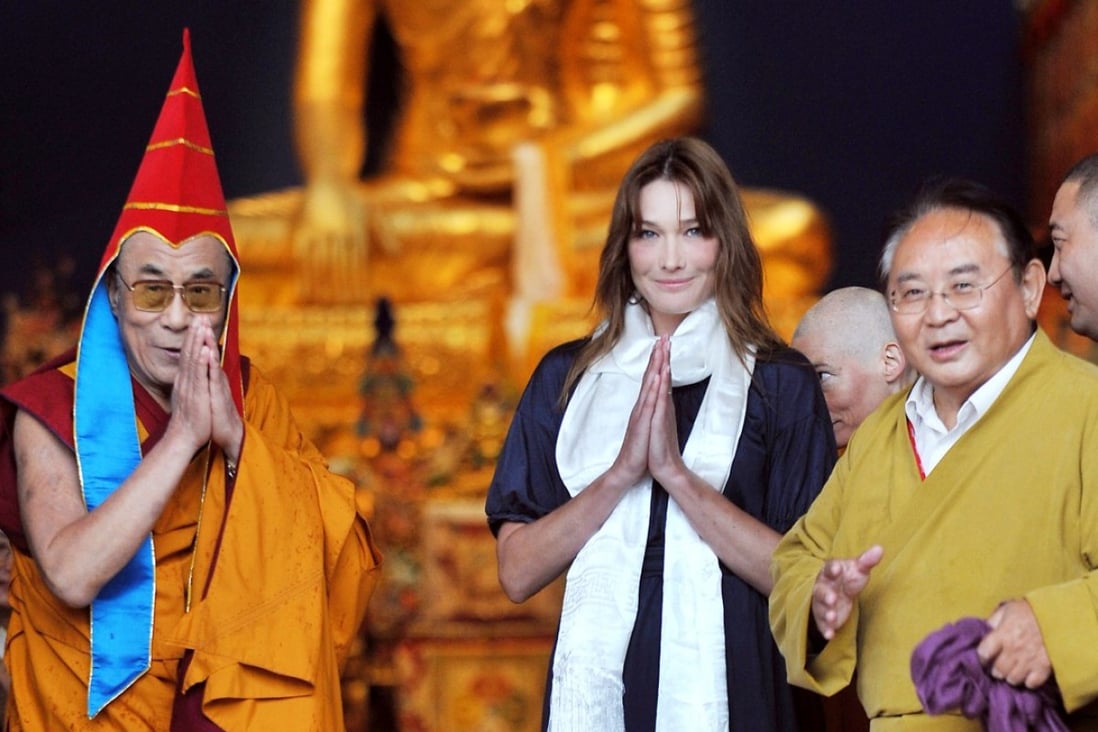 Sogyal Rinpoche (right), the Dalai Lama (left) and France’s then first lady Carla Bruni Sarkozy attend the inauguration of Lerab Ling, in southern France, on August 22, 2008. Picture: AFP