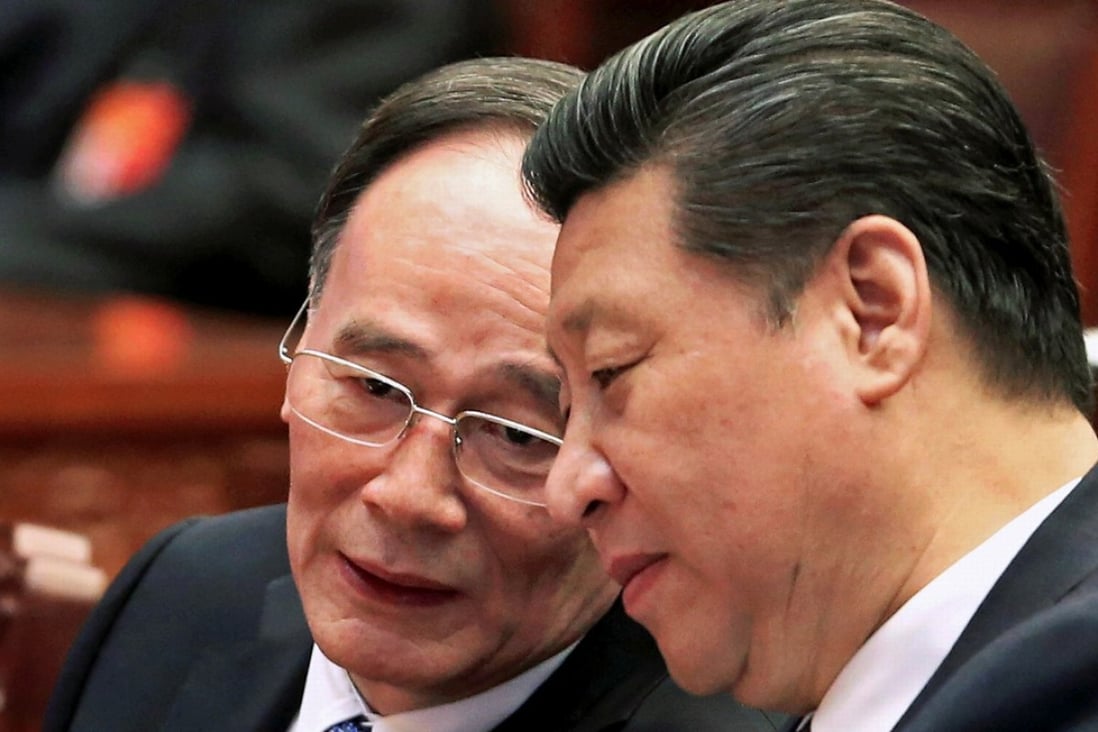 Politburo Standing Committee member Wang Qishan (left) and Communist Party general secretary Xi Jinping in Beijing in March 2015. Photo: Reuters