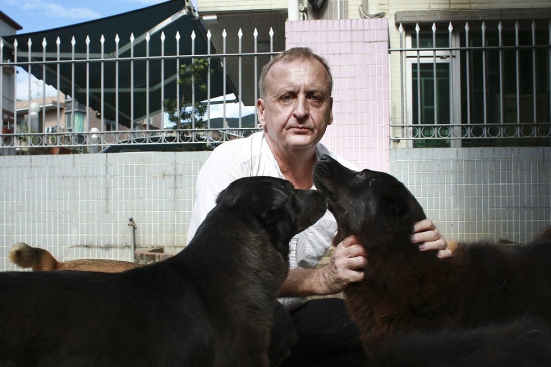 Vegan pet owner Marcus Turner and his dogs at his home in Tai Po, Hong Kong. Photo: James Wendlinger