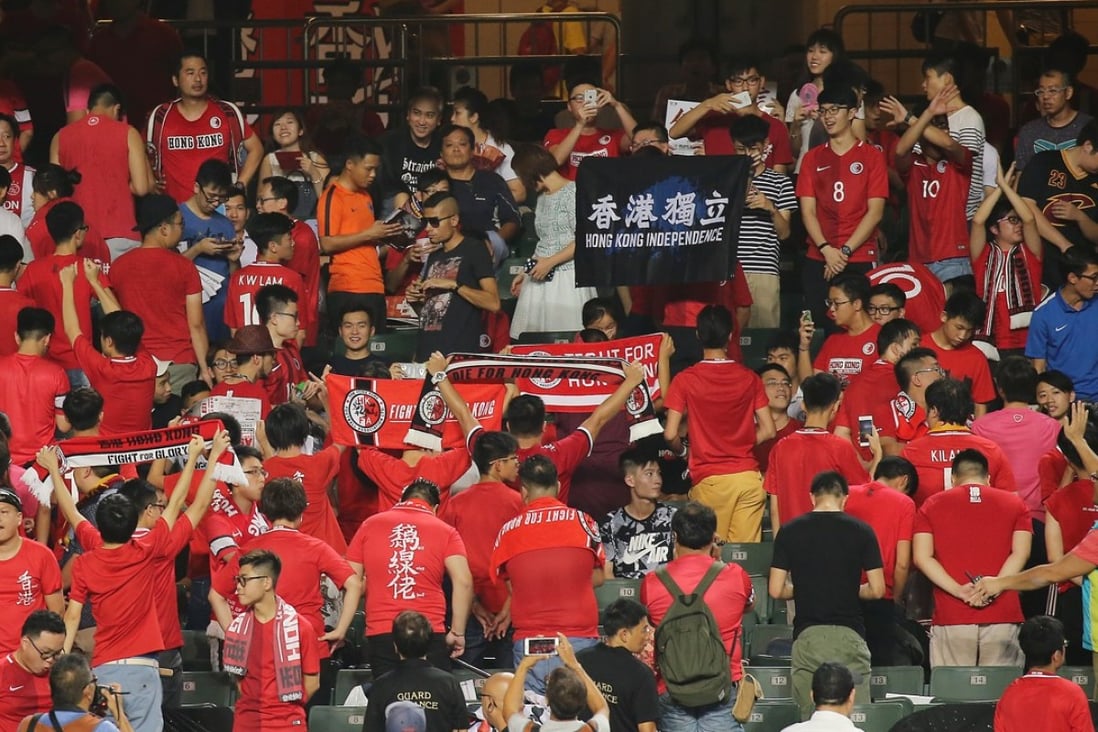 Hong Kong fans turn their back as the national anthem plays at Hong Kong Stadium. Photos: Dickson Lee
