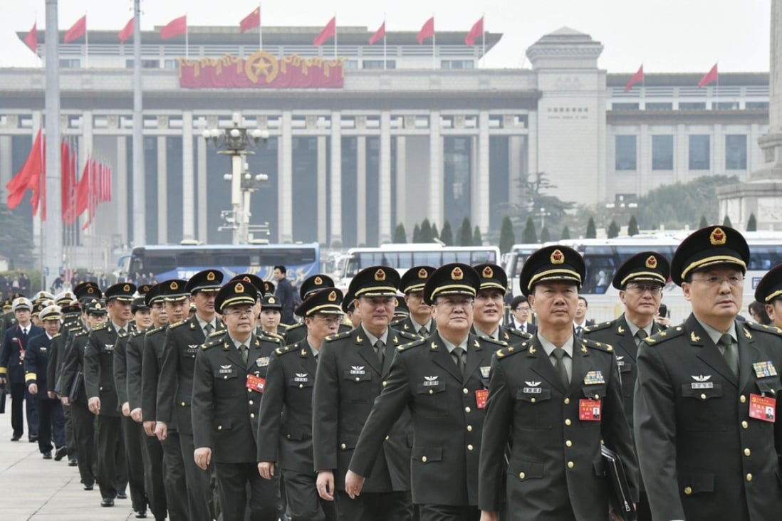Senior officers of China's People's Liberation Army enter the Great Hall of the People in Beijing on Tuesday to attend a preparatory session for the 19th National Congress of China's Communist Party. Photo: Kyodo