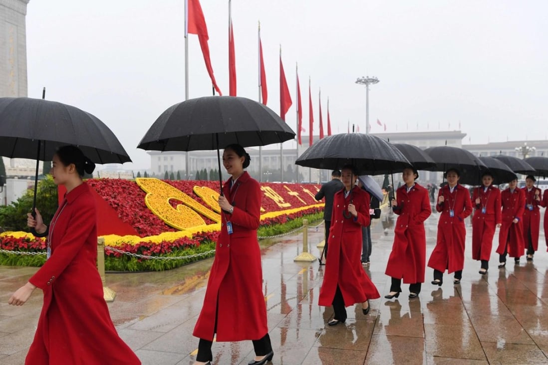 Women attendants walk in Tiananmen Square as they wait for delegates during the opening ceremony of the 19th Communist Party Congress in Beijing on October 18, 2017. An attempt by the country’s state media to gloat over the Harvey Winstein sex abuse case backfires. Photo: Agence France-Presse