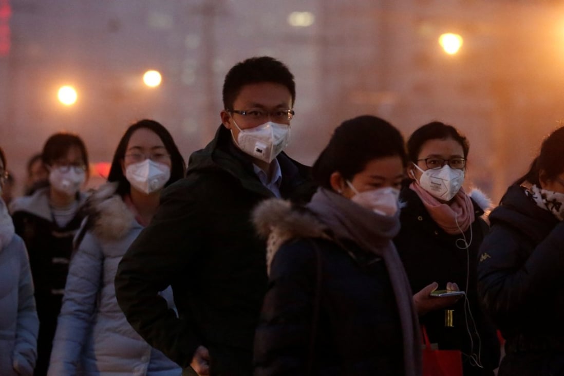 People wear face masks on a polluted day in Beijing. More than 1.8 million Chinese died from pollution-related illnesses in 2015, a new study has said. Photo: Reuters
