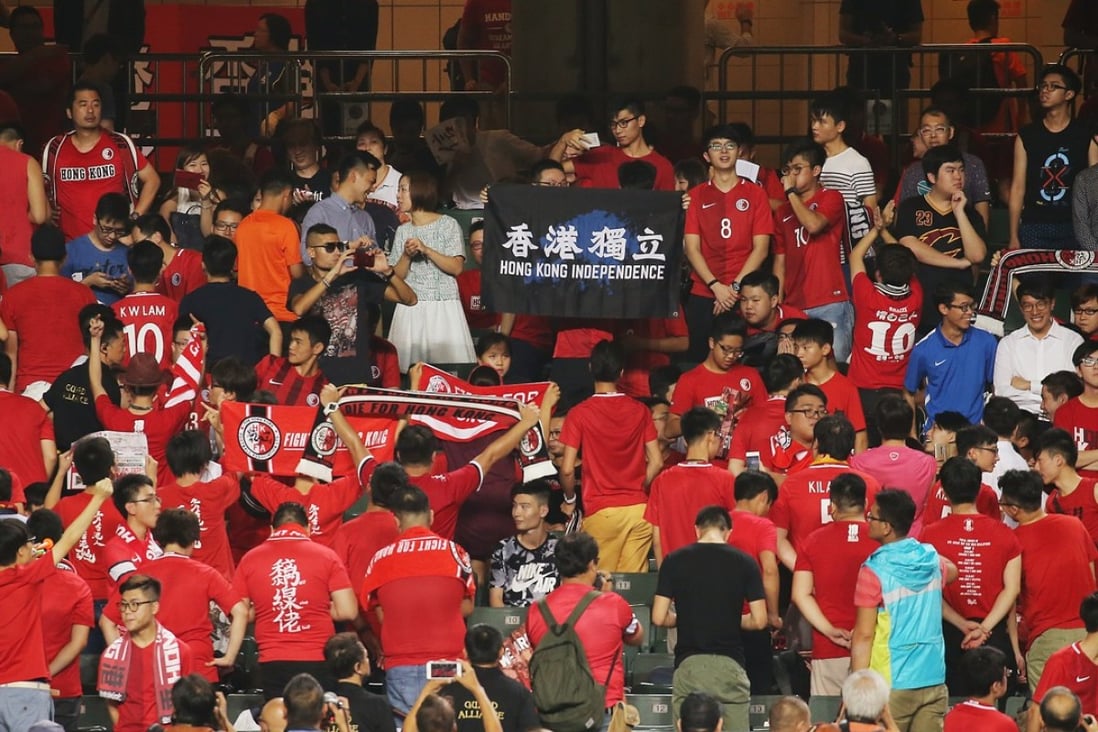 Hong Kong soccer fans turn their backs on the national anthem before a match. Photo: Dickson Lee