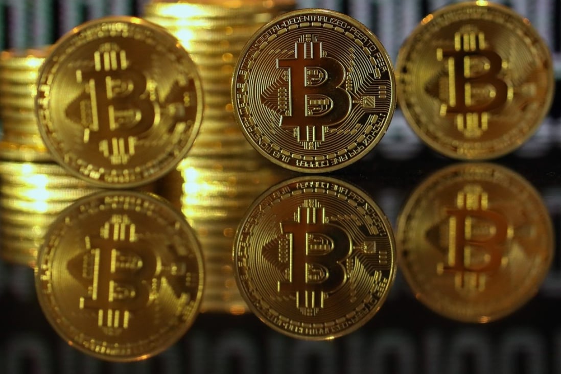 A collection of bitcoin tokens. A former US regulator told a conference in Hong Kong that more regulation of virtual currencies was on the way as governments worried about their stability. Photo: Bloomberg