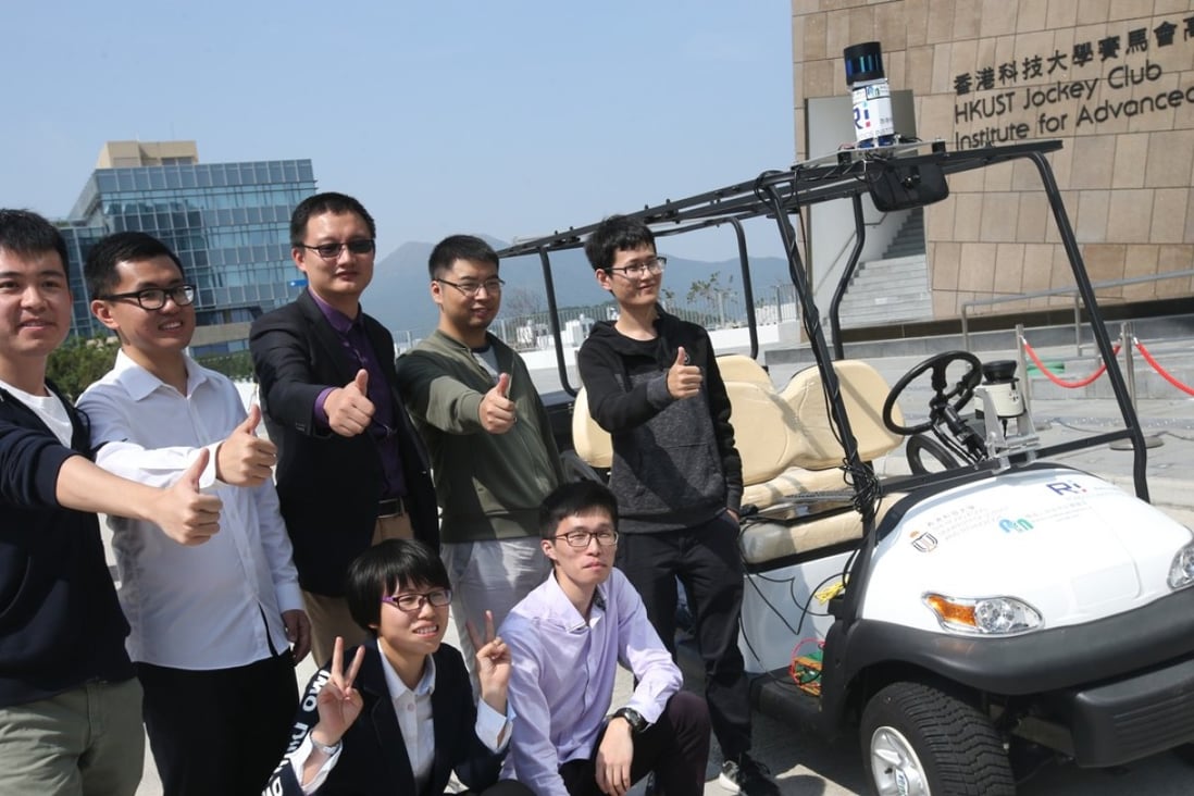 Professor Liu Ming (back row, centre) and his students pose with the first driverless car built in Hong Kong. Photo: David Wong