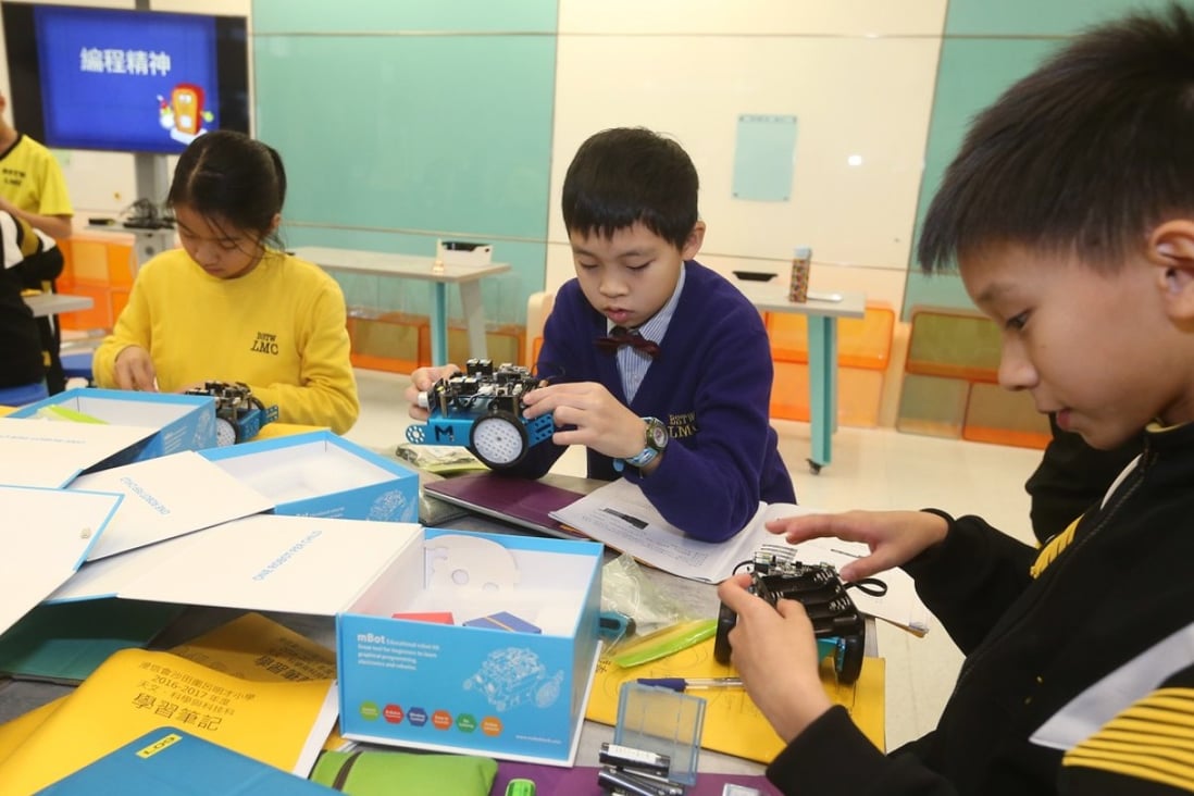 Students at a Hong Kong primary school learning robotics. US firm Wonder Works sees growing demand for its educational robots in Asia as the importance of science and technology learning increases. Photo: K.Y. Cheng