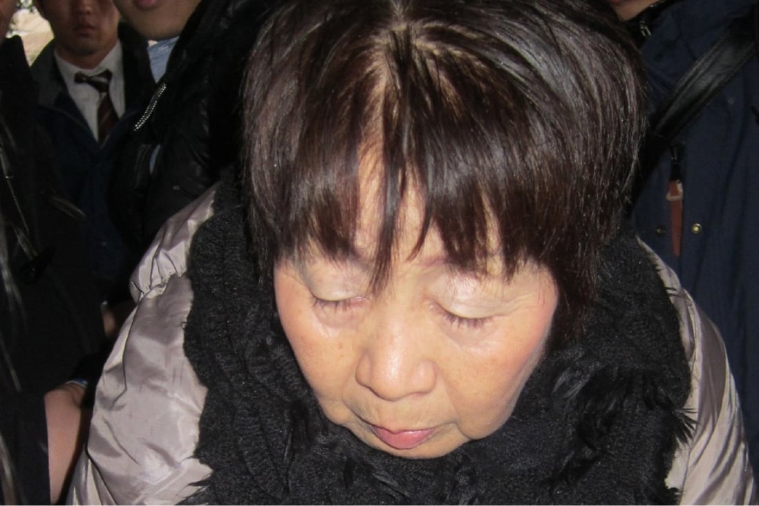 (FILES) This file photo taken on March 13, 2014 shows Japanese woman Chisako Kakehi, who was arrested on suspicion of poisoning her husband with cyanide in the latest “Black Widow” case, arriving at the Kyoto District Court. A one-time millionairess dubbed the “Black Widow” over the untimely deaths of lovers and a husband was sentenced to death on November 7, 2017, in a high-profile murder case that has gripped Japan. / AFP PHOTO / JIJI PRESS / JIJI PRESS / Japan OUT / XGTY